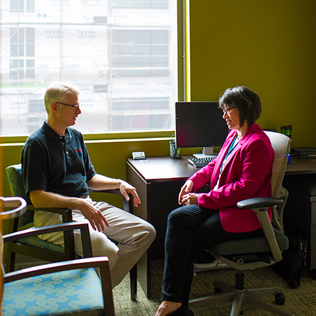 Patient Sitting with Coach Cropped